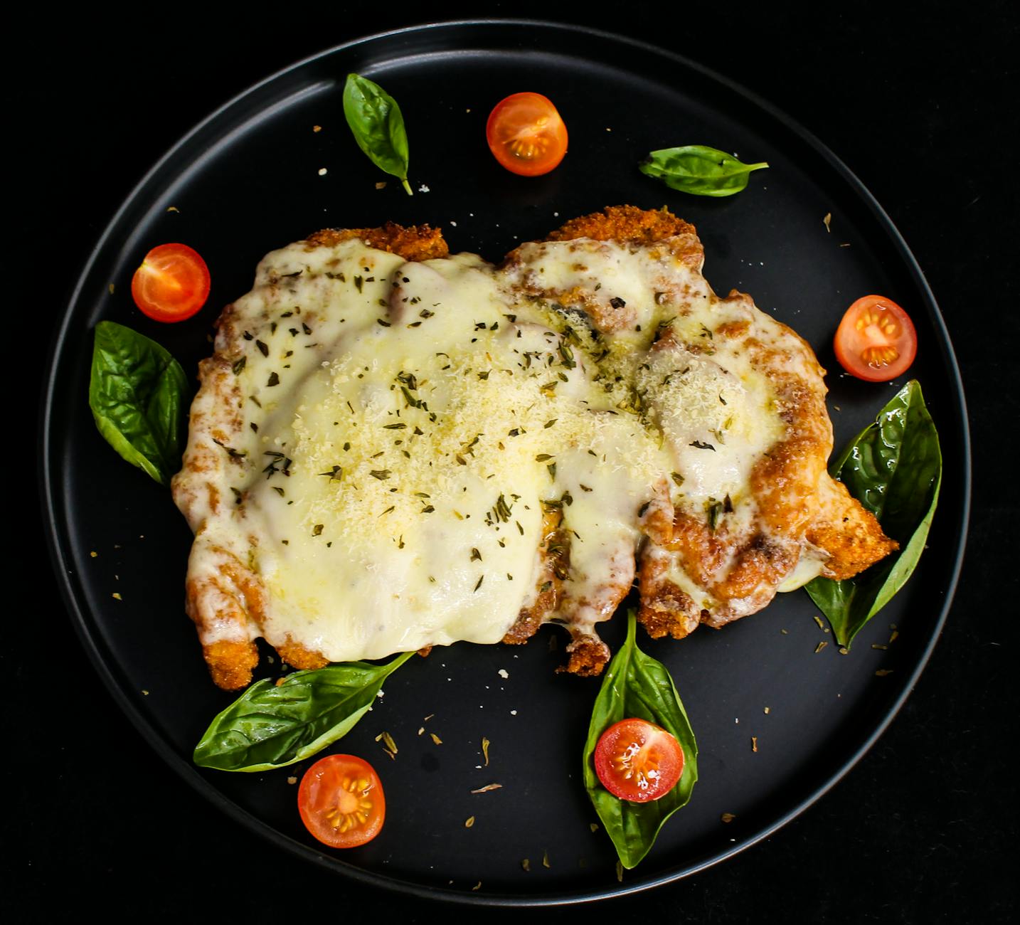 Crispy chicken parmesan topped with melted mozzarella and marinara