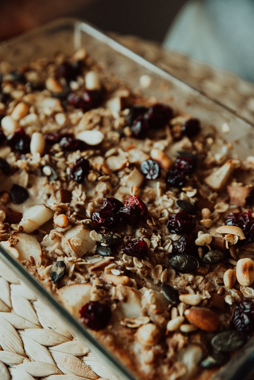 Baked oatmeal in a dish with blueberries and golden top